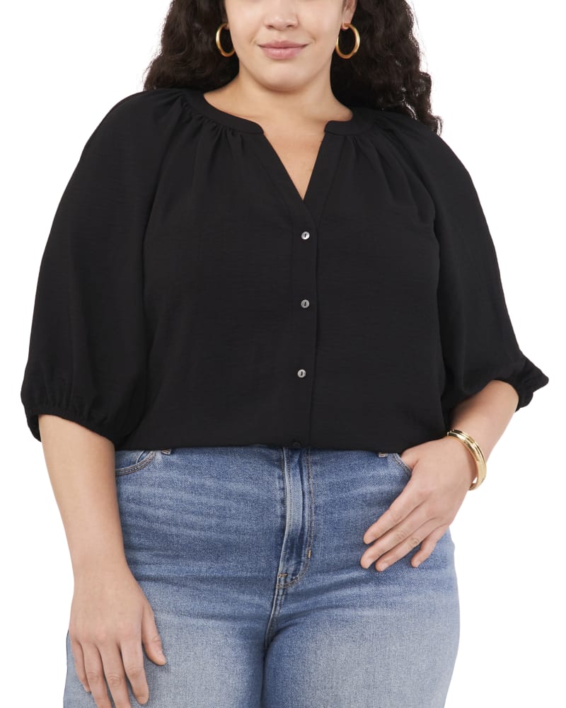 Front of a model wearing a size 1X RAGLAN BALLOON SLEEVE TOP in RICH BLACK by Vince Camuto. | dia_product_style_image_id:304544